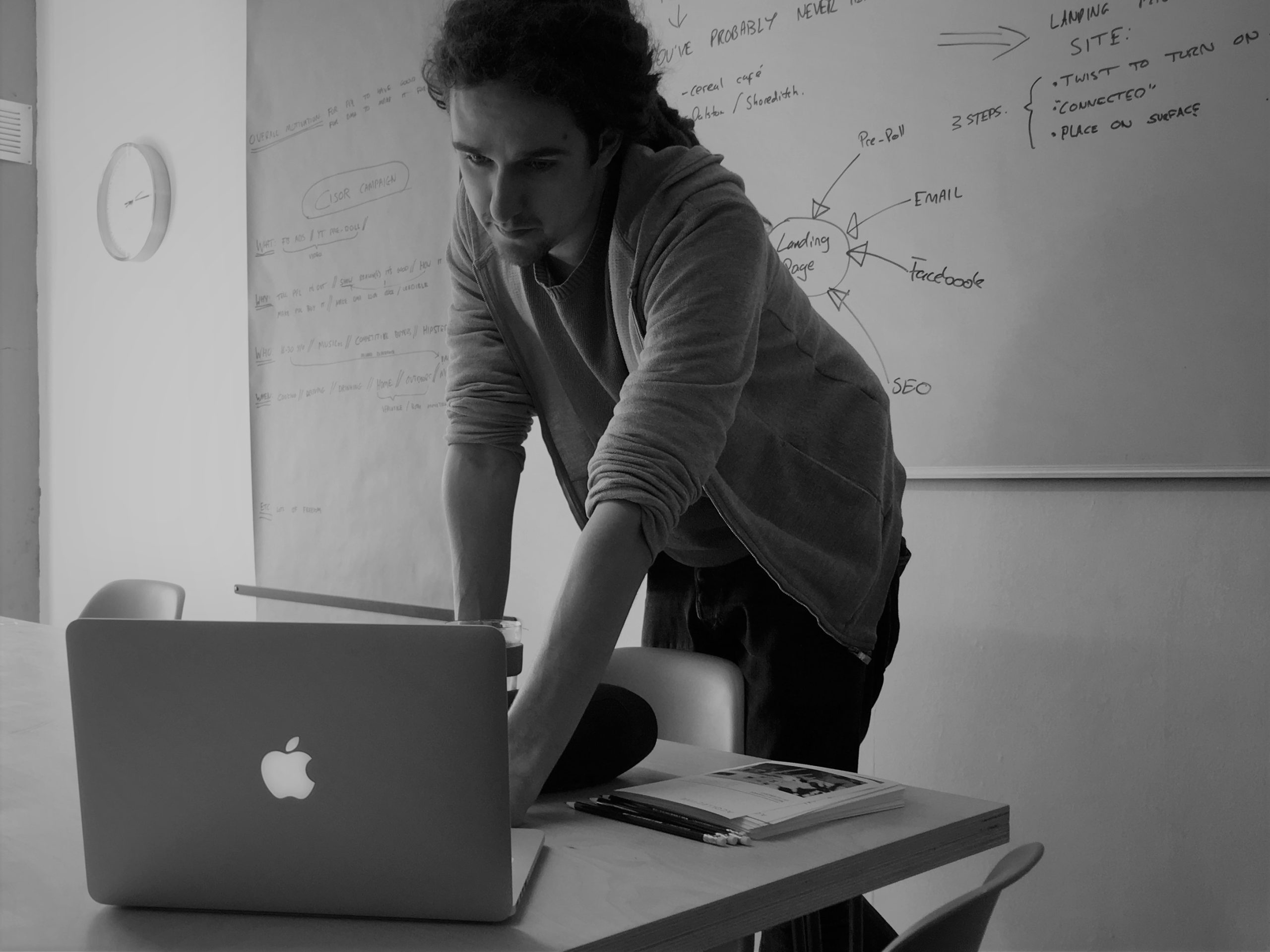 Chris founder leaning over macbook